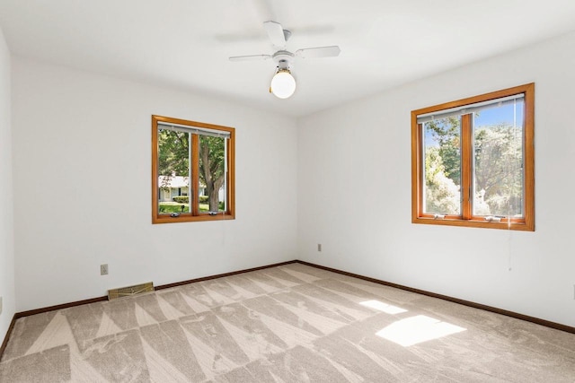 2806 Mckenna Blvd, Madison, WI 53719 - empty room with healthy amount of natural light, light carpet, and ceiling fan