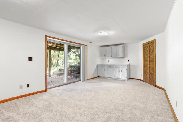 2806 Mckenna Blvd, Madison, WI 53719 - unfurnished living room featuring light colored carpet and baseboards