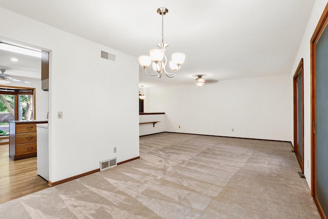 2806 Mckenna Blvd, Madison, WI 53719 - spare room with light carpet, a chandelier, and ceiling fan