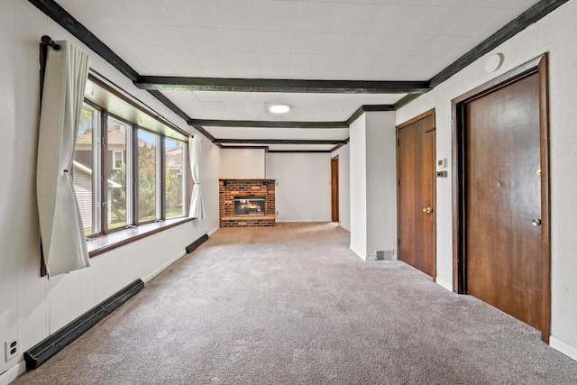 911 W Bent Ave, Oshkosh, WI 54901 - unfurnished living room featuring carpet floors, beamed ceiling, a fireplace, and baseboard heating