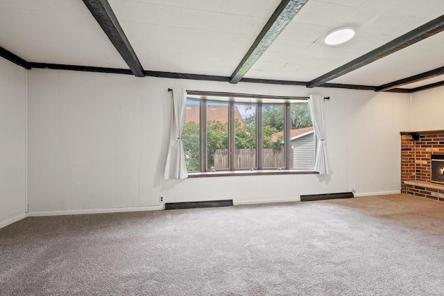 911 W Bent Ave, Oshkosh, WI 54901 - unfurnished living room featuring beam ceiling, carpet floors, healthy amount of natural light, and a fireplace