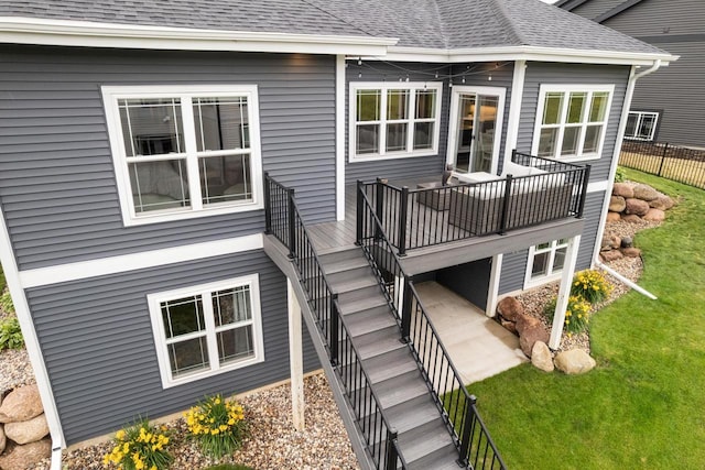 1152 Prairie View Dr, Waunakee, WI 53597 - back of property with stairs, roof with shingles, and a deck