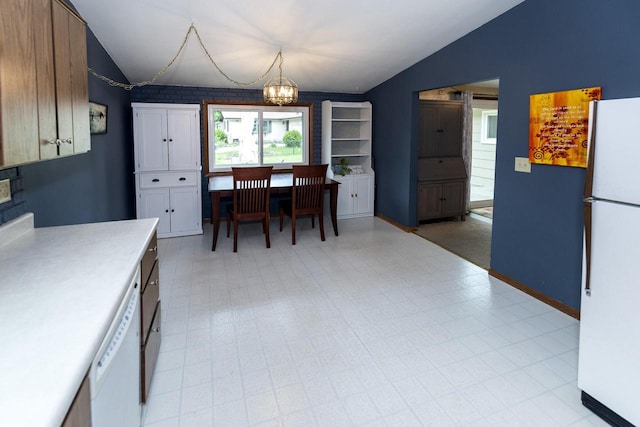 1882 Davis Ln, Waukesha, WI 53189 - dining area featuring lofted ceiling, a chandelier, and light flooring
