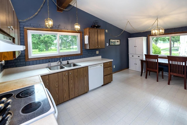 1882 Davis Ln, Waukesha, WI 53189 - kitchen with white dishwasher, lofted ceiling, plenty of natural light, and light countertops