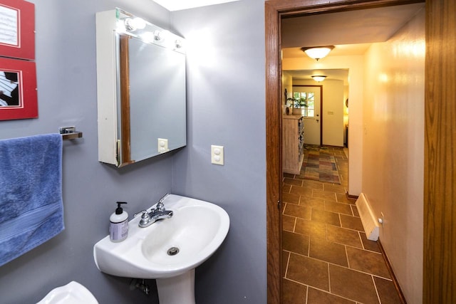 1882 Davis Ln, Waukesha, WI 53189 - half bath with a sink and baseboards