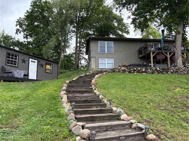 2029 Richardson Ct, Luck, WI 54853 - view of front of house with stairs, a deck, and a front yard