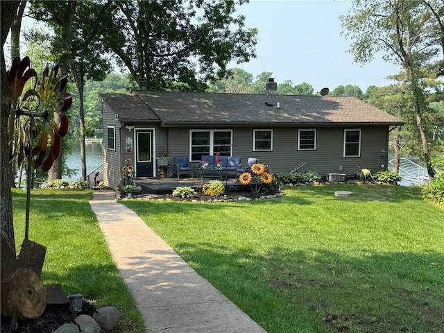 2029 Richardson Ct, Luck, WI 54853 - ranch-style home with an outdoor hangout area, a front yard, a chimney, a wooden deck, and a shingled roof