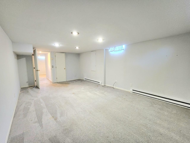 2518 Main Ave, Sheboygan, WI 53083 - finished below grade area with a baseboard radiator, light carpet, and recessed lighting