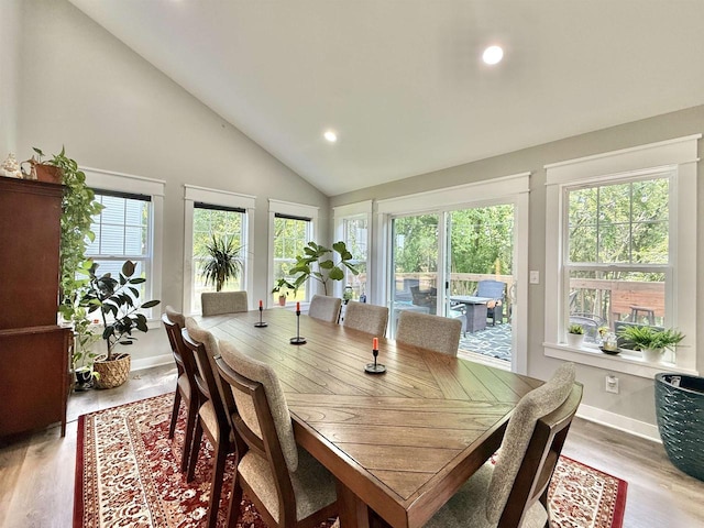 2324 Boulder Ln, Beloit, WI 53511 - dining area featuring plenty of natural light, recessed lighting, light wood-style flooring, and high vaulted ceiling