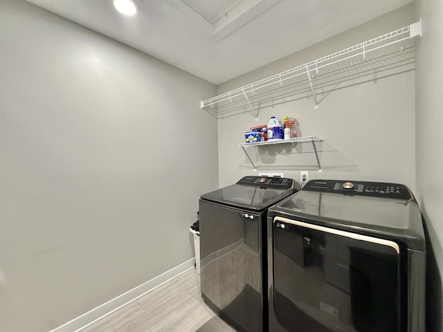 2324 Boulder Ln, Beloit, WI 53511 - washroom with washer and clothes dryer and light wood finished floors