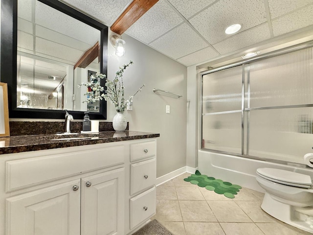 2324 Boulder Ln, Beloit, WI 53511 - full bath with tile patterned flooring, vanity, shower / bath combination with glass door, and a paneled ceiling