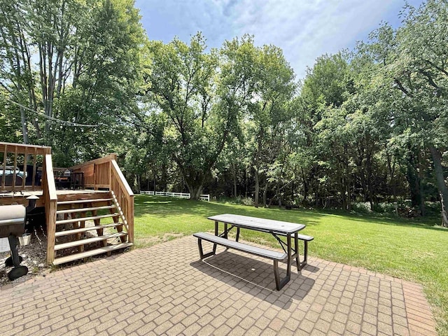 2324 Boulder Ln, Beloit, WI 53511 - view of patio with stairway, a wooden deck, and view of wooded area