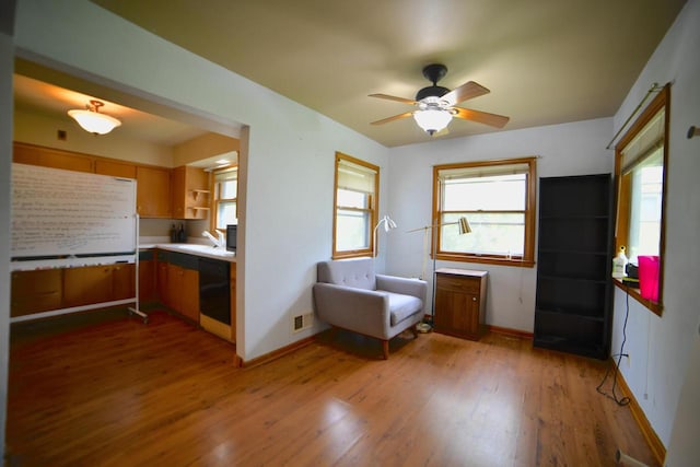 6818 W Morgan Ave, Milwaukee, WI 53220 - sitting room with wood finished floors, a ceiling fan, and plenty of natural light