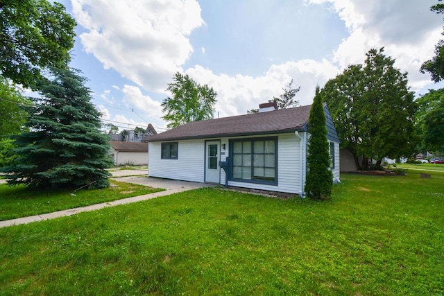 5625 N 57th St, Milwaukee, WI 53218 - ranch-style house featuring a front lawn and a chimney
