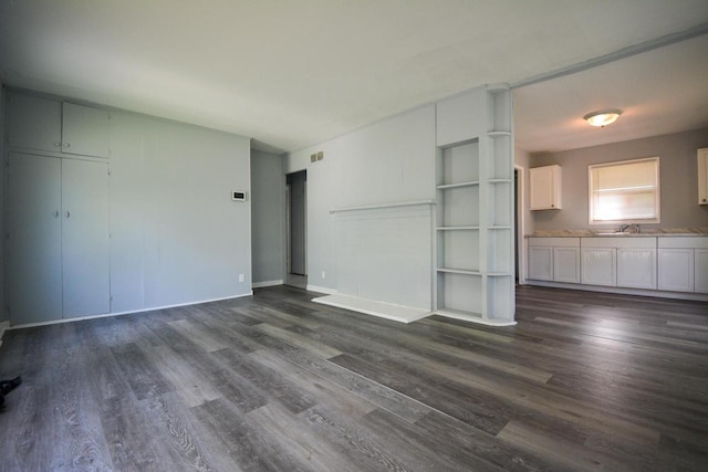 5625 N 57th St, Milwaukee, WI 53218 - unfurnished living room featuring dark wood-style flooring