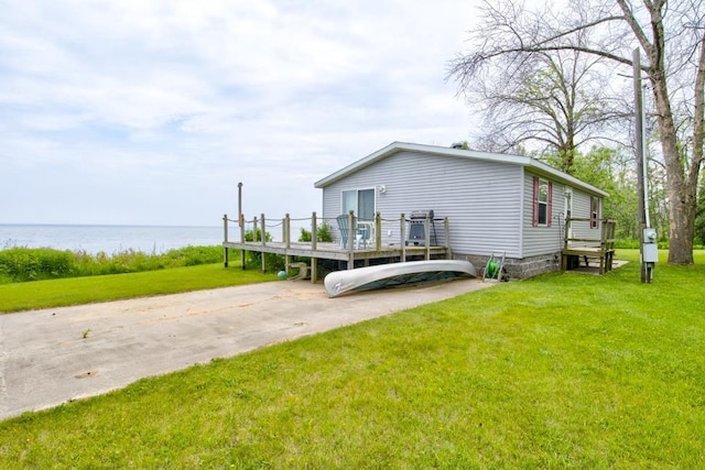 N3688 M-35, Menominee, MI 49858 - view of side of property with a deck with water view and a lawn