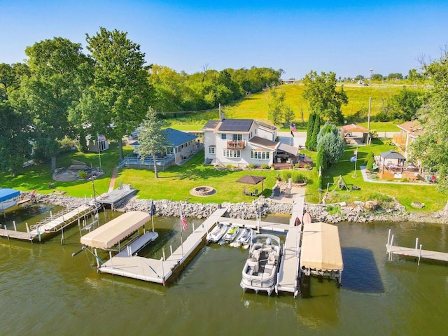 442 E Richardson Springs Rd, Edgerton, WI 53534 - dock area featuring boat lift, a water view, and an outdoor fire pit