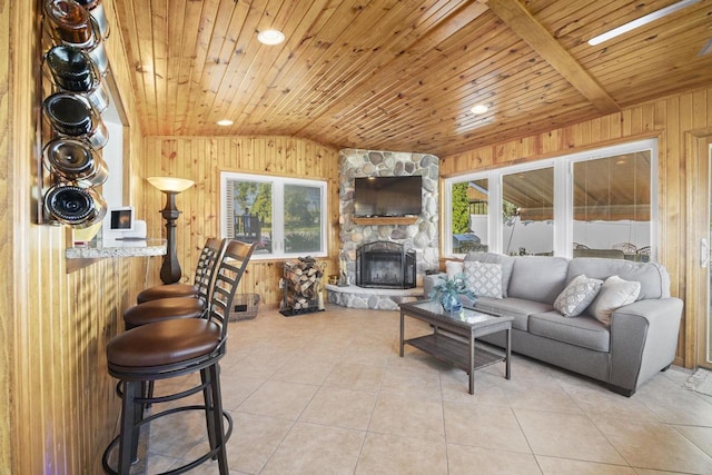 442 E Richardson Springs Rd, Edgerton, WI 53534 - living room featuring wooden ceiling, lofted ceiling, wood walls, light tile patterned flooring, and healthy amount of natural light