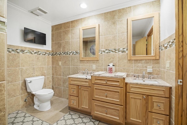 442 E Richardson Springs Rd, Edgerton, WI 53534 - full bathroom featuring tile walls, double vanity, crown molding, and tile patterned floors