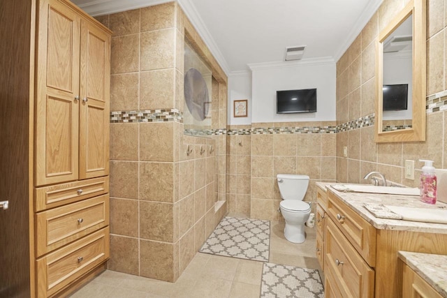 442 E Richardson Springs Rd, Edgerton, WI 53534 - full bathroom featuring tile walls, ornamental molding, vanity, a tile shower, and tile patterned floors