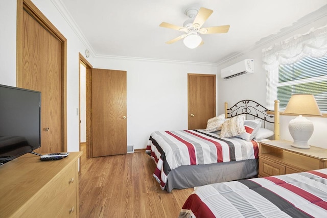442 E Richardson Springs Rd, Edgerton, WI 53534 - bedroom featuring an AC wall unit, crown molding, light wood finished floors, and a ceiling fan