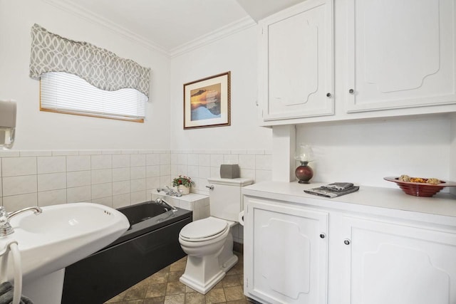 442 E Richardson Springs Rd, Edgerton, WI 53534 - full bathroom featuring tile walls, a garden tub, and crown molding