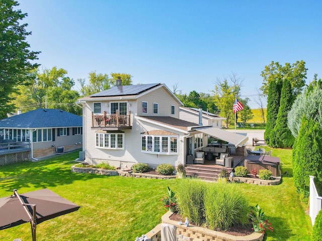 442 E Richardson Springs Rd, Edgerton, WI 53534 - back of house featuring a balcony, roof mounted solar panels, a yard, and a deck