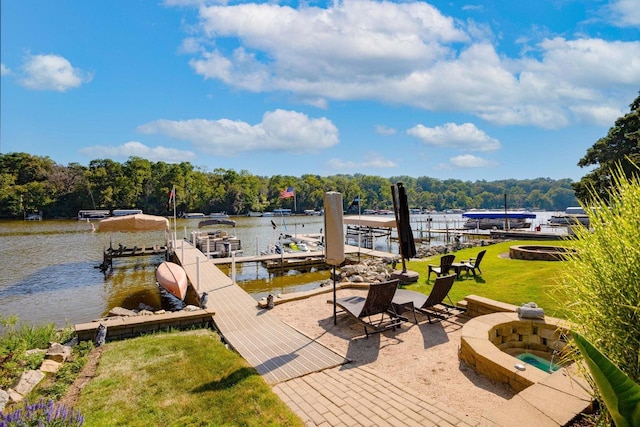 442 E Richardson Springs Rd, Edgerton, WI 53534 - dock with an outdoor fire pit, a water view, a lawn, and a wooded view