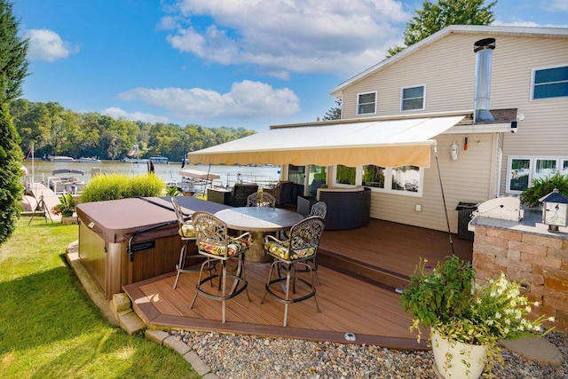 442 E Richardson Springs Rd, Edgerton, WI 53534 - deck featuring a hot tub, outdoor dining space, and a yard