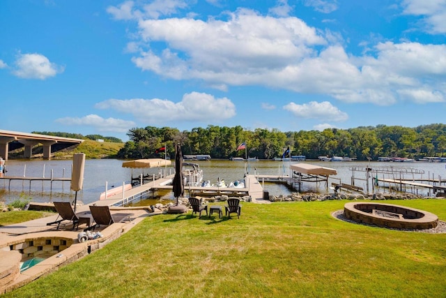 442 E Richardson Springs Rd, Edgerton, WI 53534 - dock area with boat lift, a water view, a lawn, and a fire pit