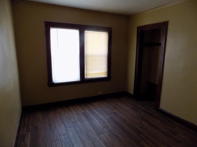 3152 N 38th St Unit 3154, Milwaukee, WI 53216 - unfurnished bedroom with dark wood-style floors and baseboards