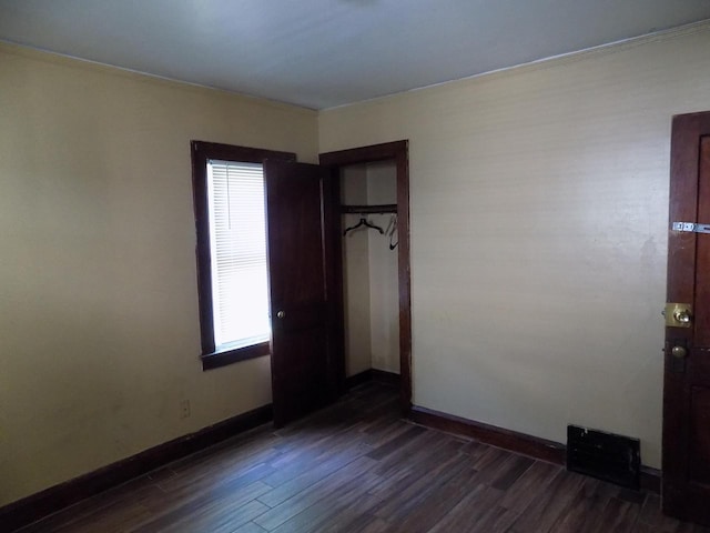 3152 N 38th St Unit 3154, Milwaukee, WI 53216 - spare room featuring healthy amount of natural light and dark wood-style flooring