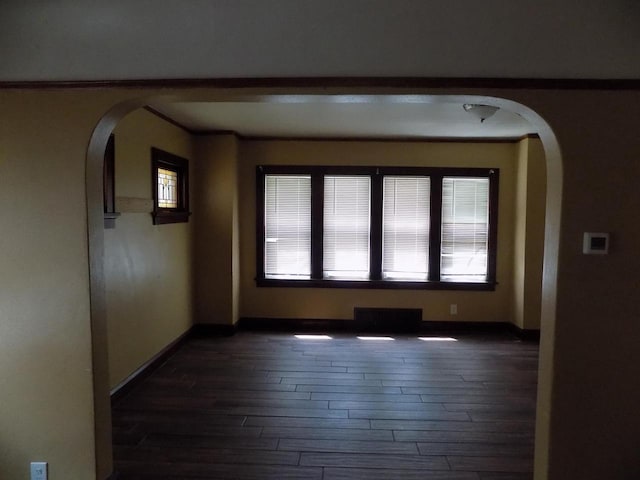 3152 N 38th St Unit 3154, Milwaukee, WI 53216 - spare room with arched walkways and dark wood-style floors