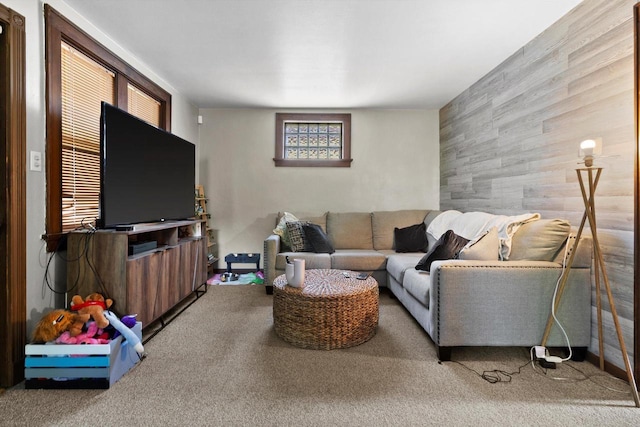 2147 S 71st St, West Allis, WI 53219 - living room featuring carpet flooring, an accent wall, and wooden walls