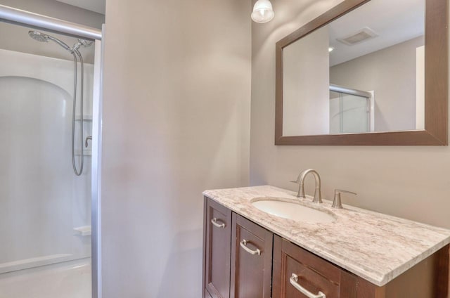 1626 N Warren Ave, Milwaukee, WI 53202 - full bathroom featuring a stall shower and vanity