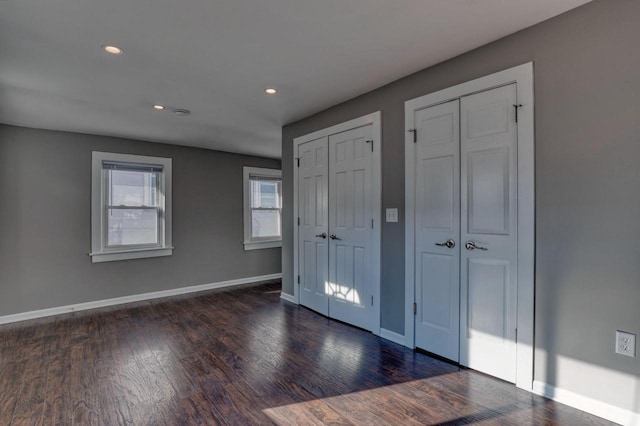 1626 N Warren Ave, Milwaukee, WI 53202 - unfurnished bedroom with two closets, wood finished floors, and recessed lighting