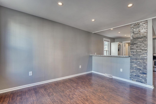 1626 N Warren Ave, Milwaukee, WI 53202 - unfurnished living room featuring wood finished floors and recessed lighting