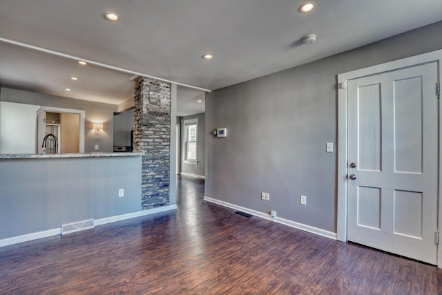 1626 N Warren Ave, Milwaukee, WI 53202 - unfurnished living room with wood finished floors and recessed lighting