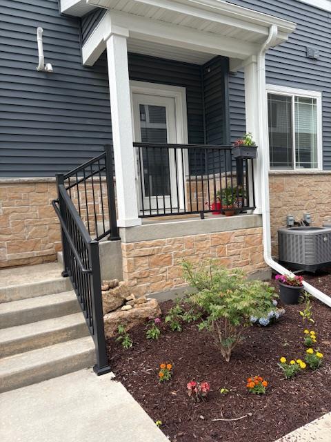 1965 N Windsor Ave, Cottage Grove, WI 53527 - view of exterior entry featuring stone siding and a porch