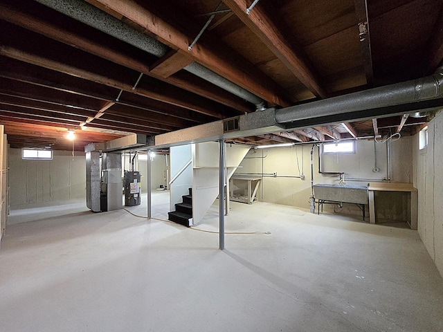 3680 E Klieforth Ave, Cudahy, WI 53110 - below grade area with gas water heater, stairs, and heating unit