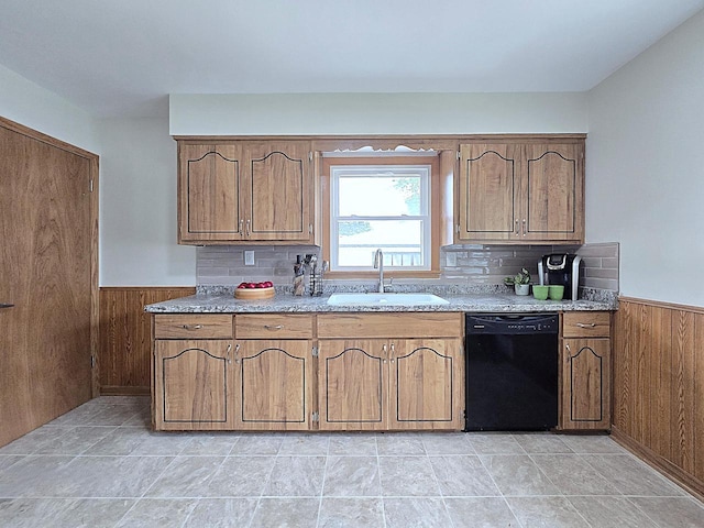 3680 E Klieforth Ave, Cudahy, WI 53110 - kitchen with dishwasher, wainscoting, wood walls, light countertops, and decorative backsplash
