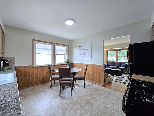 3680 E Klieforth Ave, Cudahy, WI 53110 - dining area featuring wainscoting and wooden walls