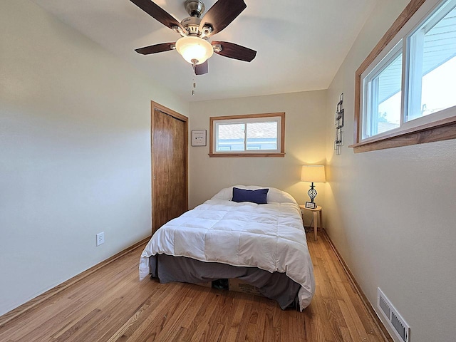 3680 E Klieforth Ave, Cudahy, WI 53110 - bedroom with light wood-style floors, a closet, and ceiling fan