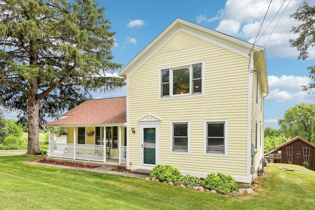 N64W20755 Mill Rd, Menomonee Falls, WI 53051 - view of front facade featuring covered porch and a front yard