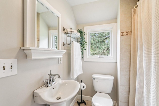 N64W20755 Mill Rd, Menomonee Falls, WI 53051 - bathroom featuring a shower with curtain, lofted ceiling, and tile patterned flooring
