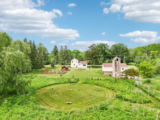 N64W20755 Mill Rd, Menomonee Falls, WI 53051 - view of grassy yard featuring an outdoor structure and a forest view
