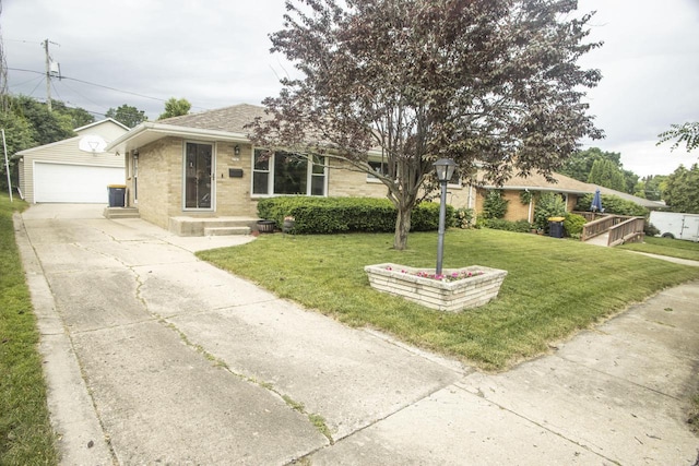 2563 S 91st St, West Allis, WI 53227 - view of front of house featuring an outbuilding, a garage, brick siding, and a front lawn