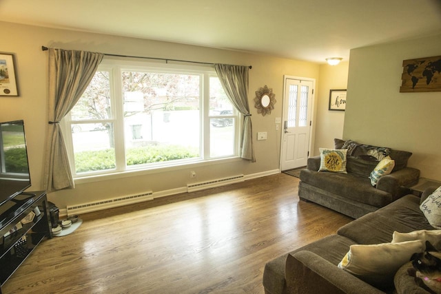 2563 S 91st St, West Allis, WI 53227 - living area featuring a baseboard heating unit and plenty of natural light