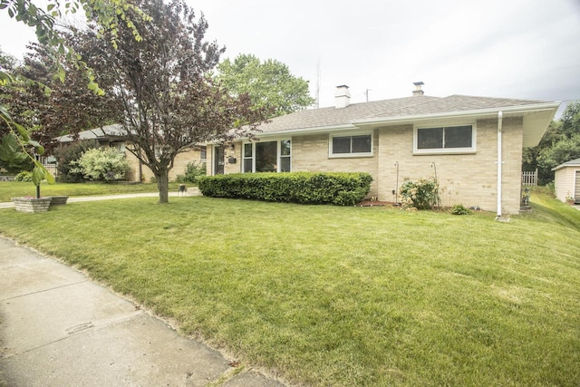 2563 S 91st St, West Allis, WI 53227 - single story home featuring a front lawn, a chimney, brick siding, and roof with shingles