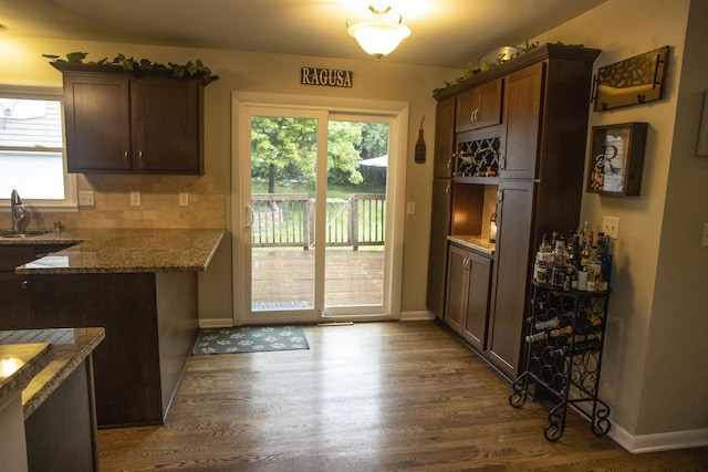 2563 S 91st St, West Allis, WI 53227 - kitchen with dark wood finished floors, healthy amount of natural light, and dark brown cabinets